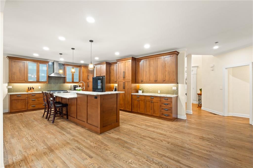 67 Pointer Lane Braselton, GA 30517 - Photo 14 of 45 a kitchen with kitchen island wooden cabinets and counter space