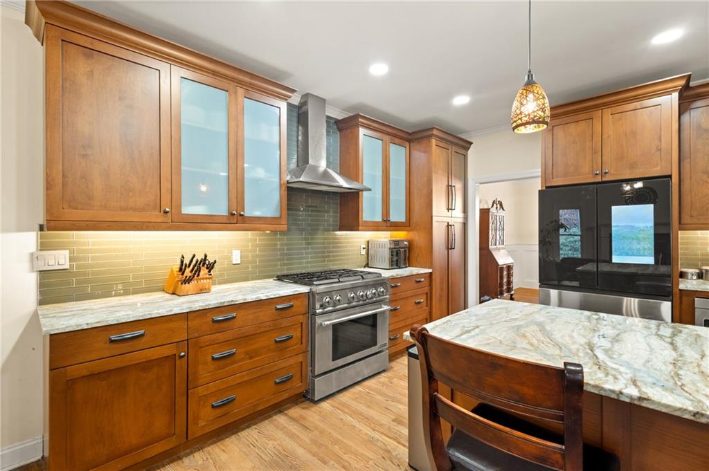 67 Pointer Lane Braselton, GA 30517 - Photo 15 of 45 a kitchen with a stove a sink and a refrigerator