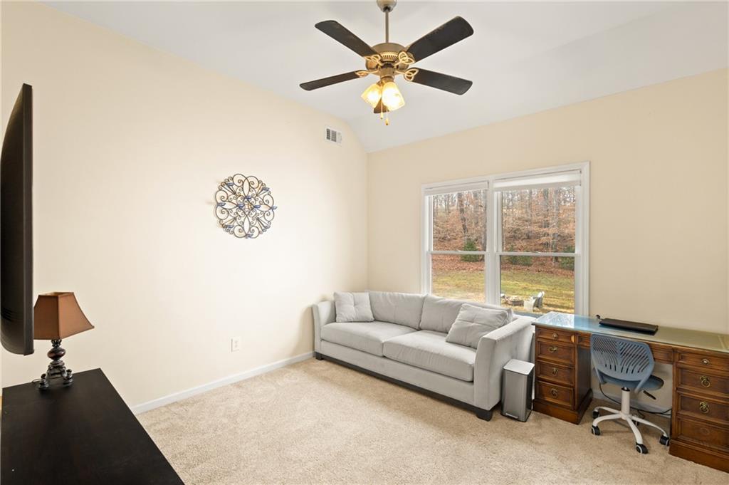67 Pointer Lane Braselton, GA 30517 - Photo 30 of 45 a living room with furniture and a large window