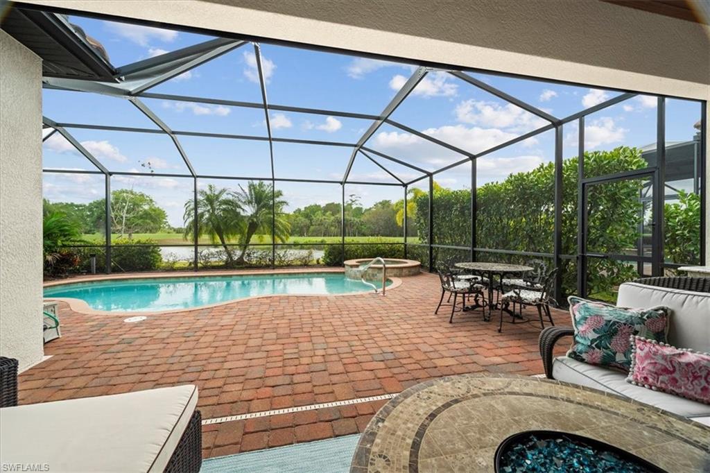 12840 Kinross Lane Naples, FL 34120 - Photo 1 of 44 a view of swimming pool with a patio