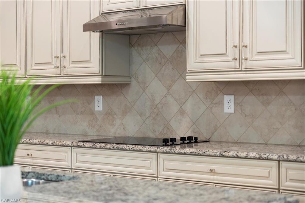 12840 Kinross Lane Naples, FL 34120 - Photo 13 of 44 a view of white cabinets and a window