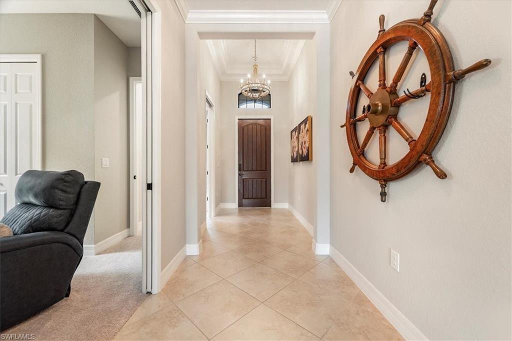 12840 Kinross Lane Naples, FL 34120 - Photo 2 of 44 a view of a livingroom with furniture and a window