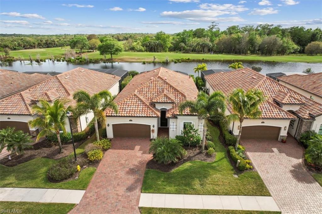 12840 Kinross Lane Naples, FL 34120 - Photo 28 of 44 an aerial view of a house with garden space and a patio