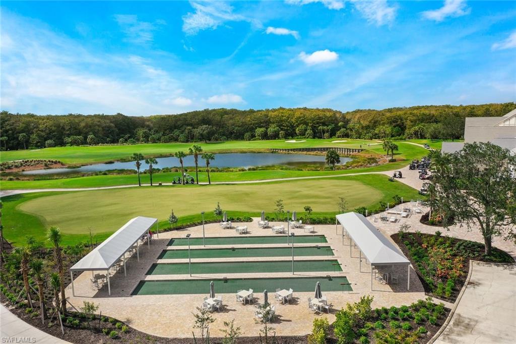 12840 Kinross Lane Naples, FL 34120 - Photo 37 of 44 a view of a garden with an outdoor space