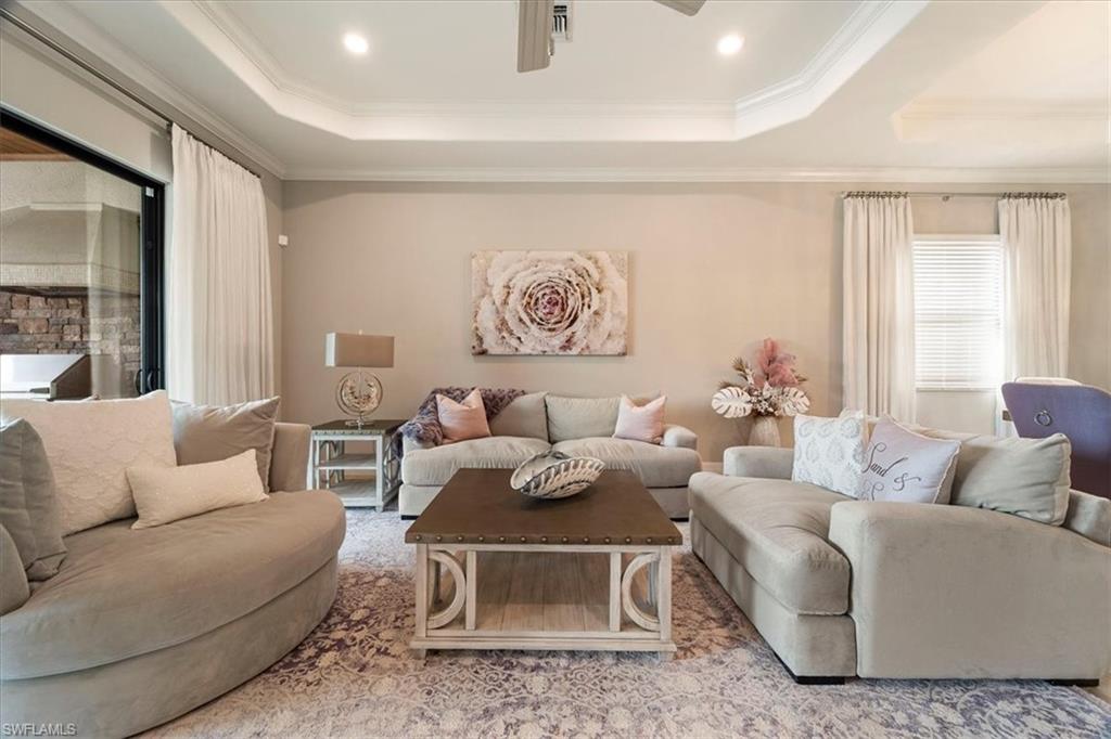 12840 Kinross Lane Naples, FL 34120 - Photo 5 of 44 a living room with furniture and a large window