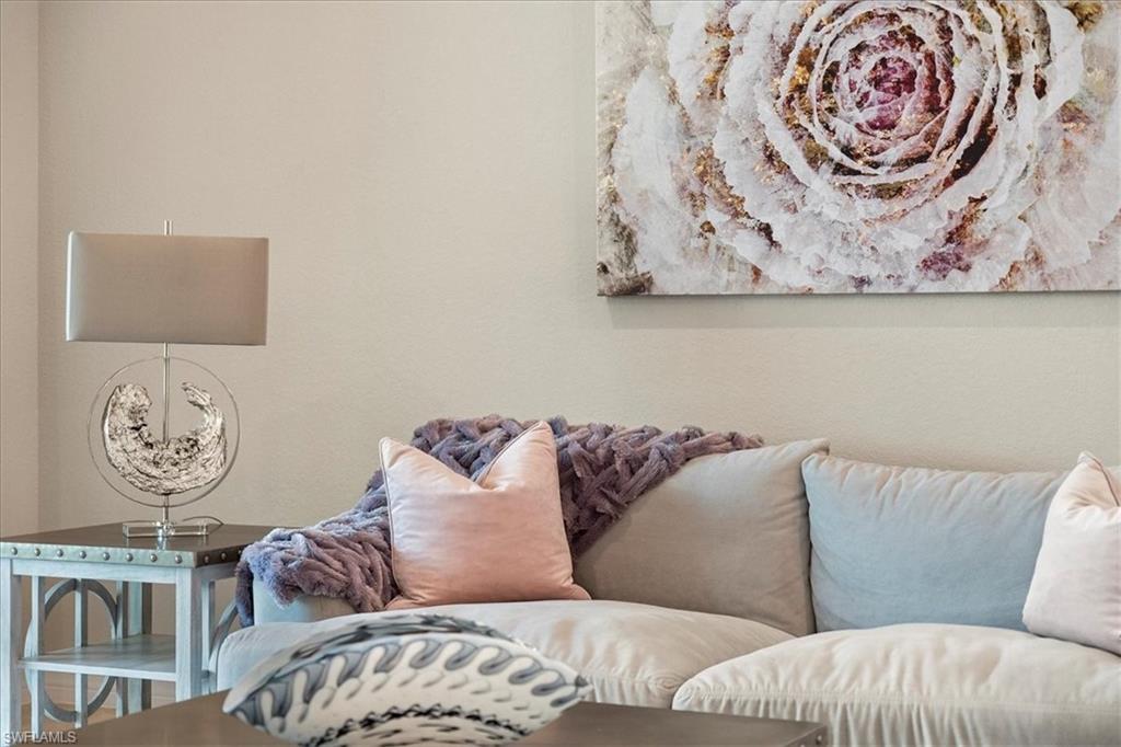 12840 Kinross Lane Naples, FL 34120 - Photo 6 of 44 a living room with a couch