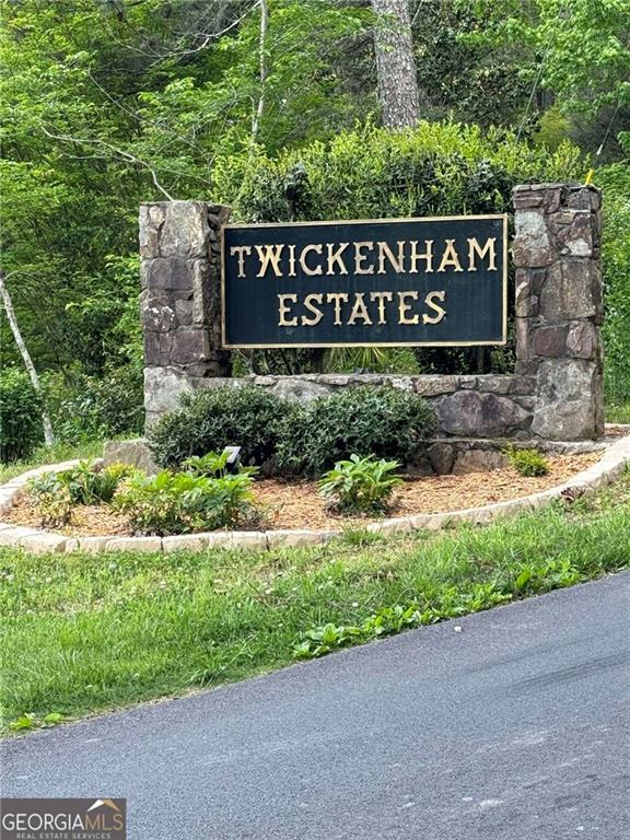 a sign broad in front of flowers