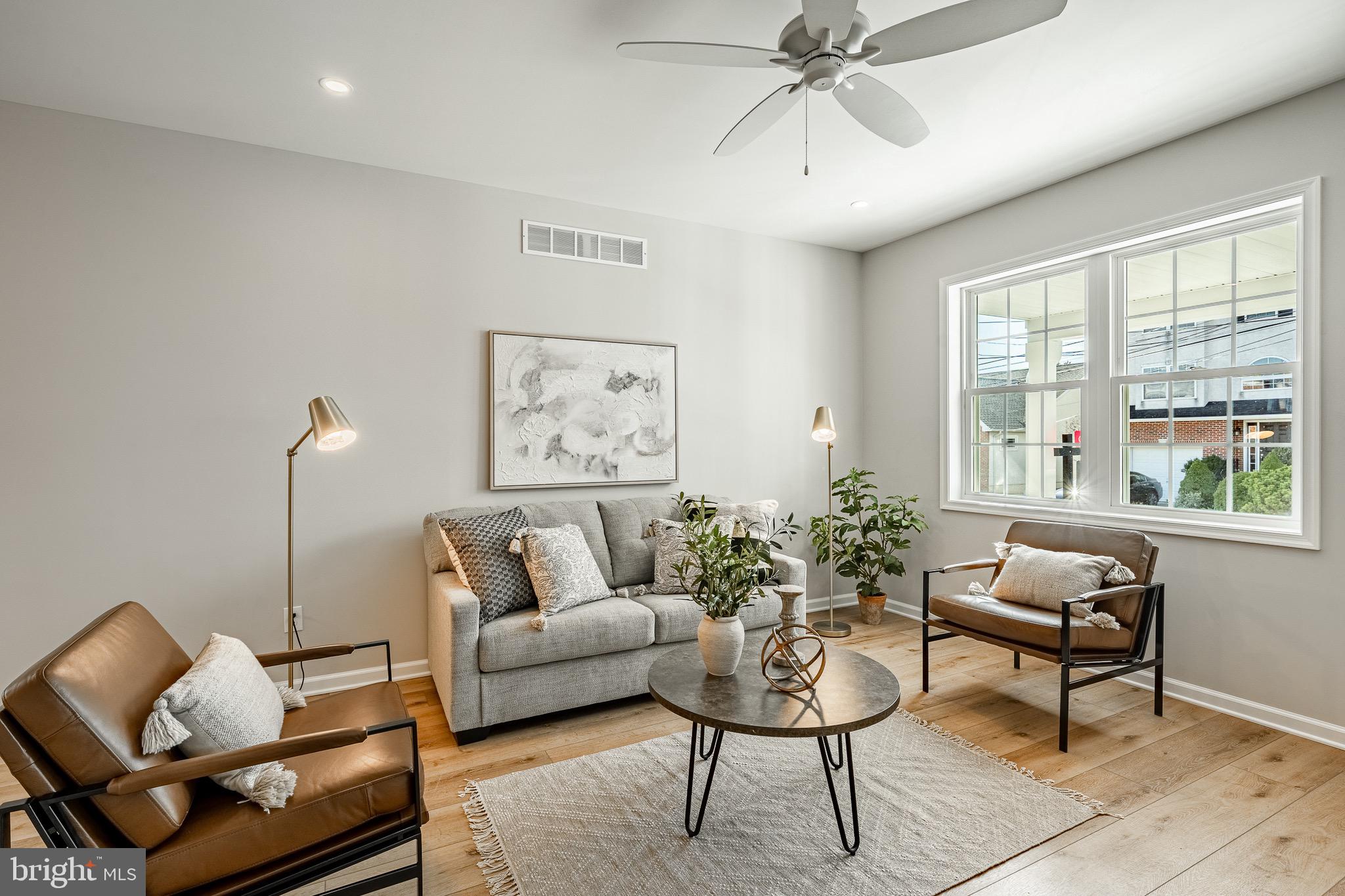 523 Grove Street Bridgeport, PA 19405 - Photo 7 of 25 a living room with furniture and a large window