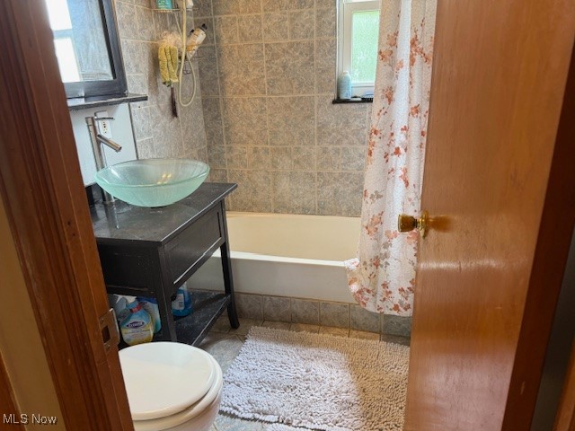 15513 Rockside Road Maple Heights, OH 44137 - Photo 6 of 11 Full bathroom with vanity, shower / bath combo, and tile patterned floors