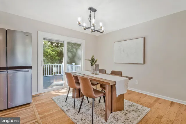 a kitchen with cabinets stainless steel appliances and a window