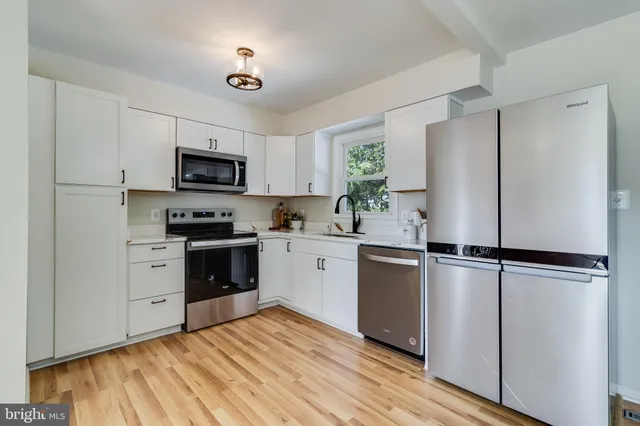 a view of balcony with wooden floor and fence