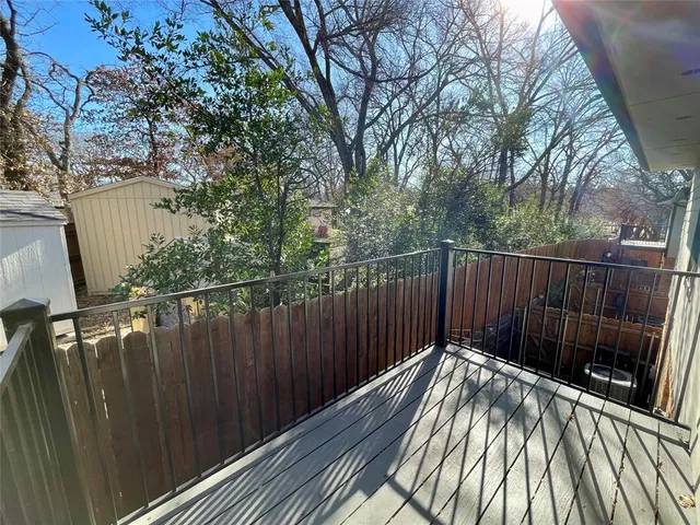 a view of walk in closet with clothes