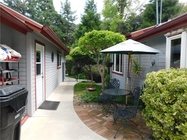 a view of a backyard with sitting area