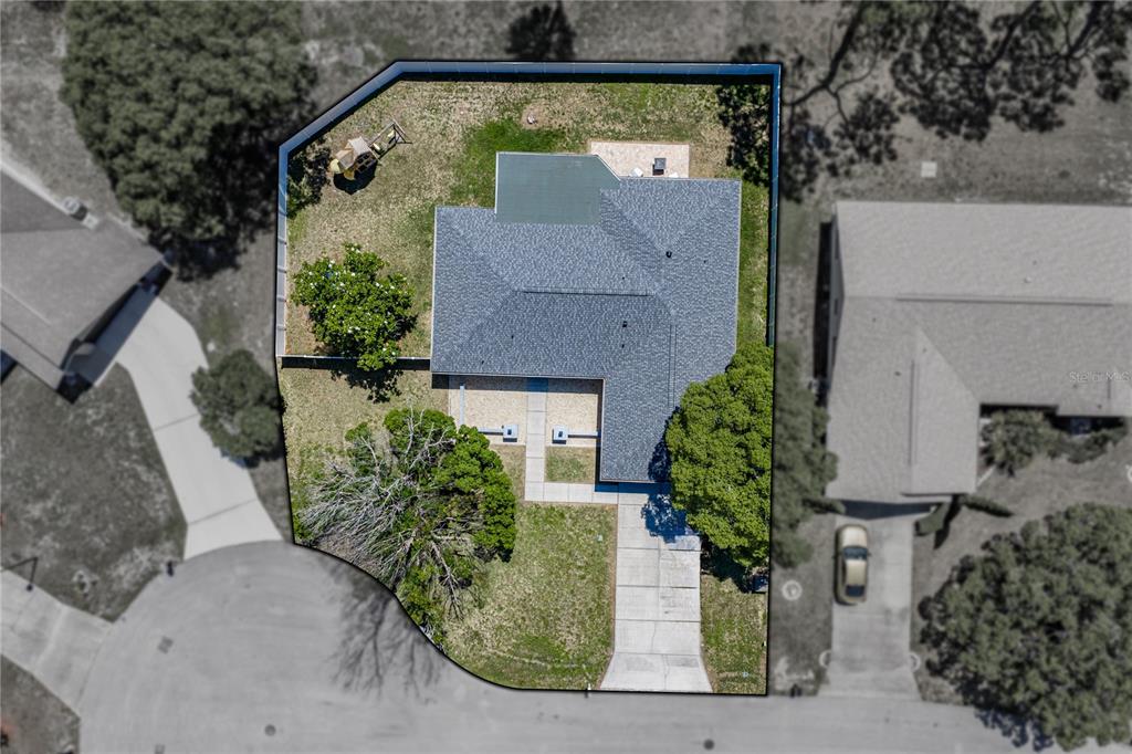 7435 Kilbride Court Weeki Wachee, FL 34613 - Photo 51 of 67 an aerial view of a house with a yard