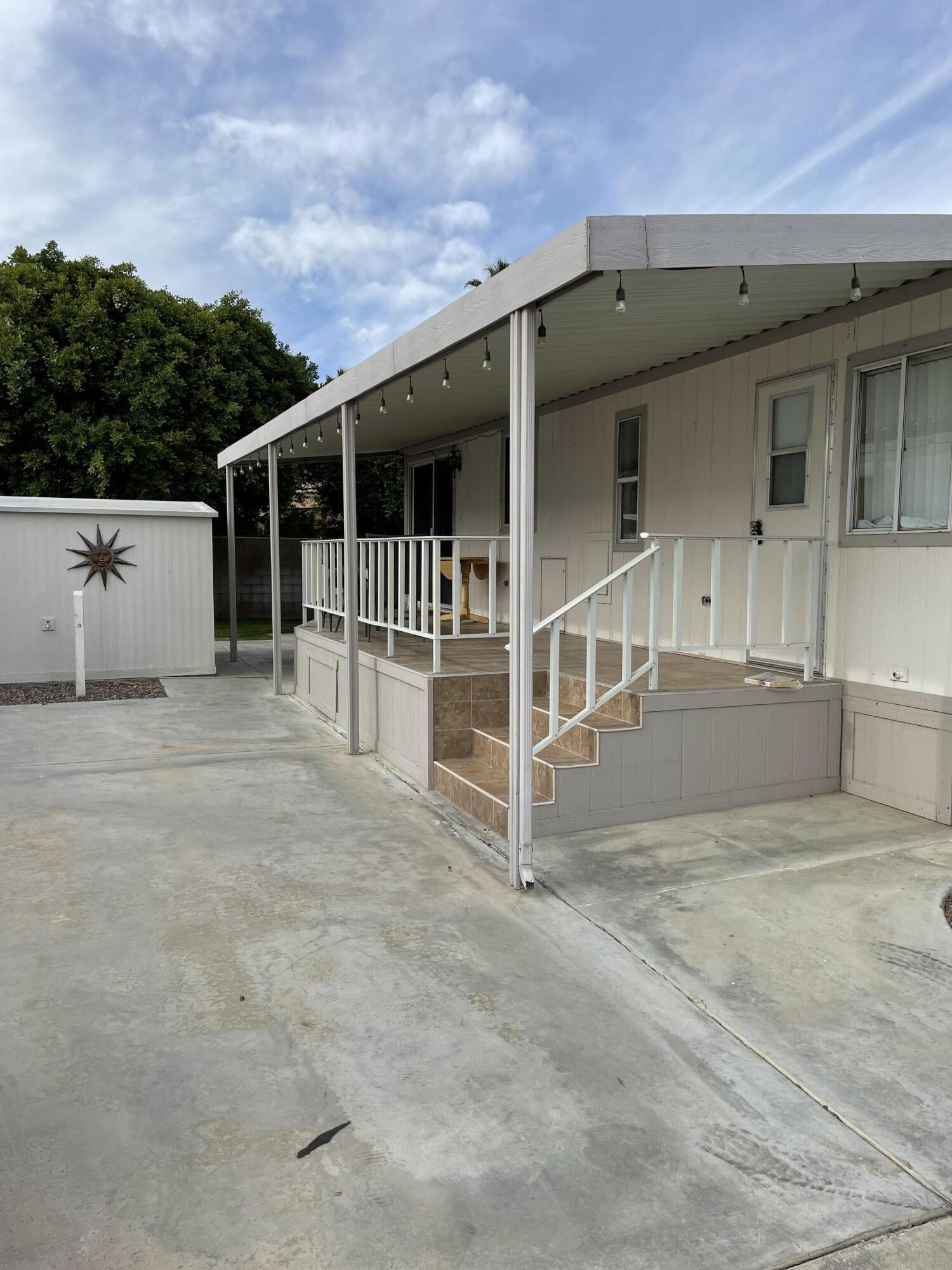 81620 Ave 49, Unit 27A Indio, CA 92201 - Photo 11 of 22 front view of a house with a fence