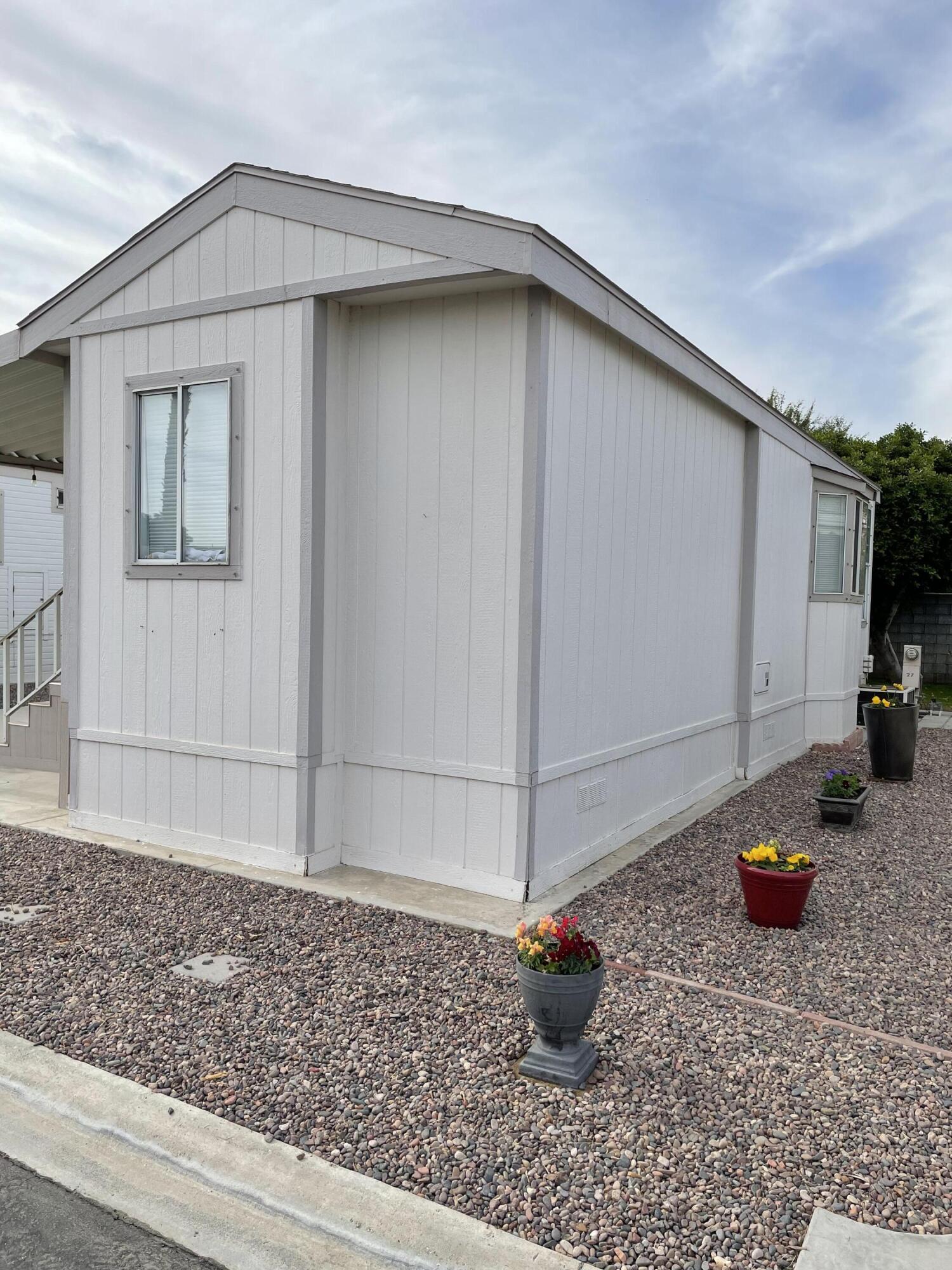 81620 Ave 49, Unit 27A Indio, CA 92201 - Photo 12 of 22 a house view with a backyard space