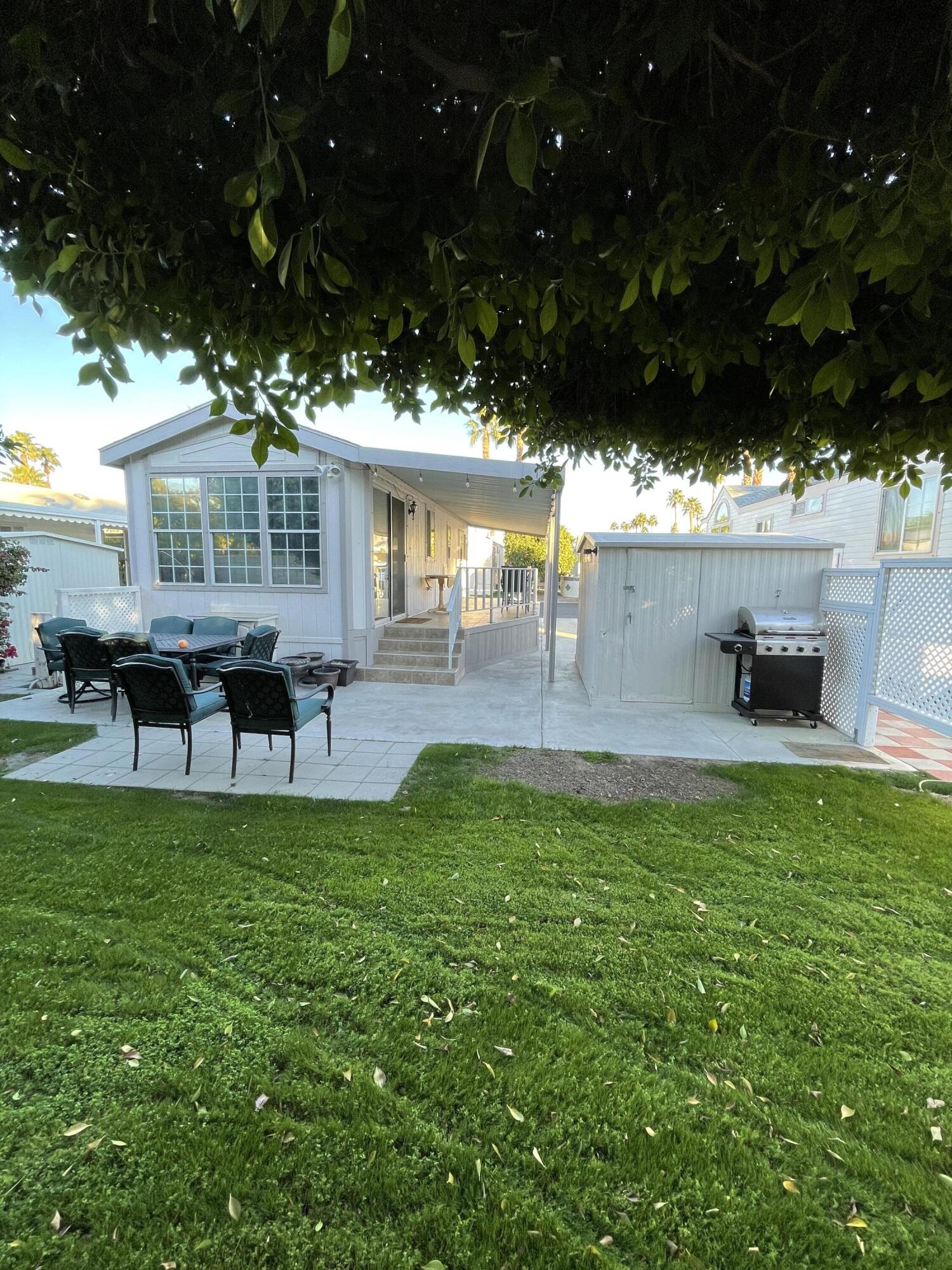 81620 Ave 49, Unit 27A Indio, CA 92201 - Photo 13 of 22 a view of a house with backyard porch and sitting area