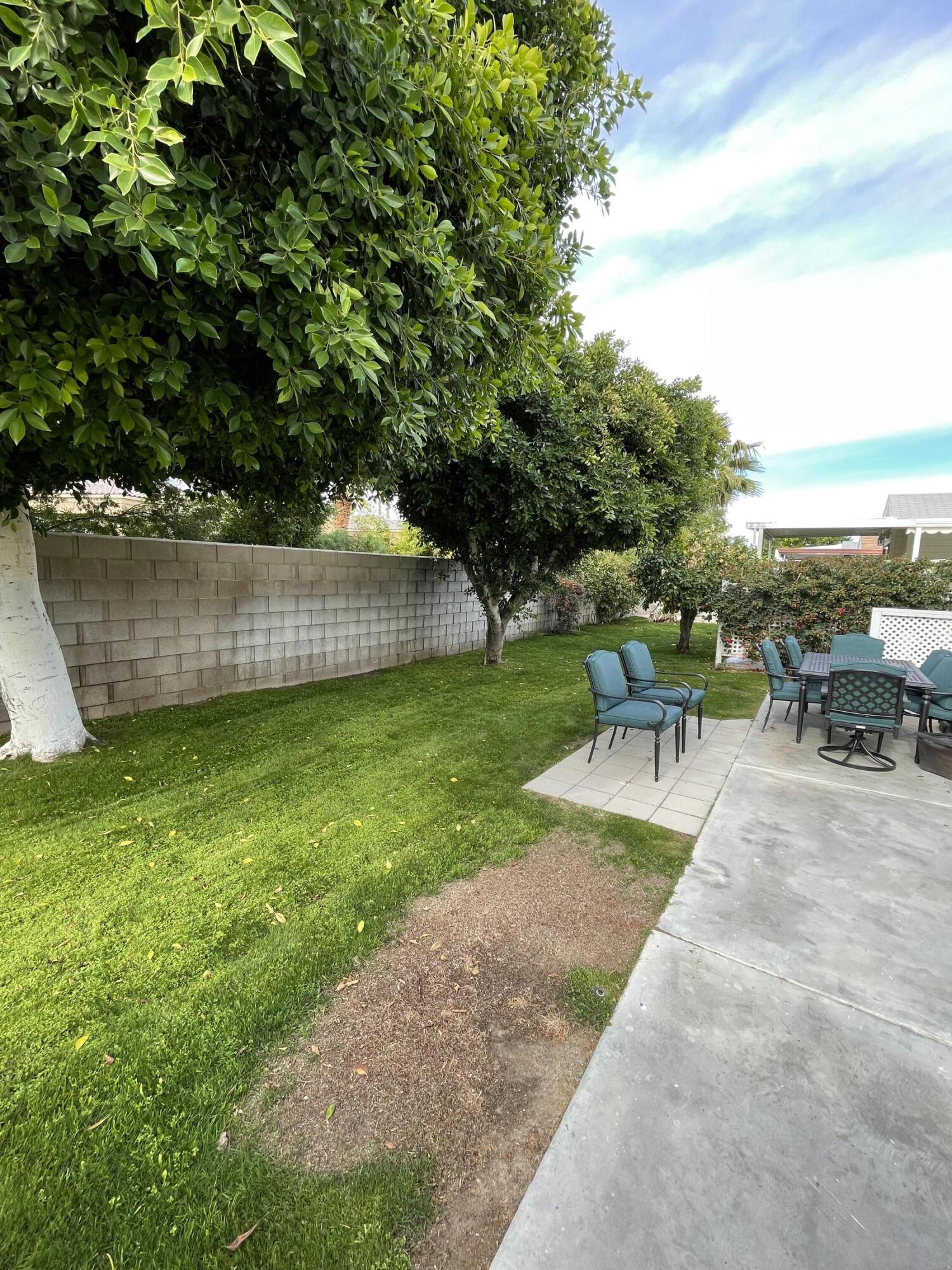 81620 Ave 49, Unit 27A Indio, CA 92201 - Photo 8 of 22 a view of a backyard with sitting area