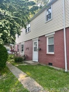 69 High Ridge Drive Bridgeport, CT 06606 - Photo 1 of 1 a front view of house with yard and green space