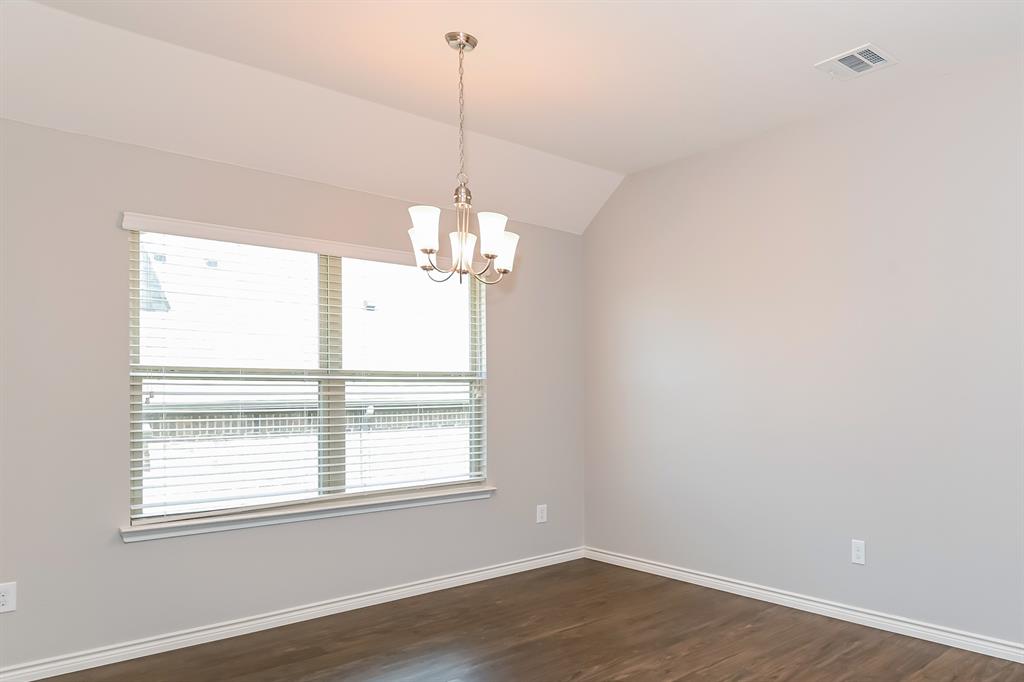 571 Kara Drive Fate, TX 75087 - Photo 3 of 16 a view of a windows and chandelier in a room