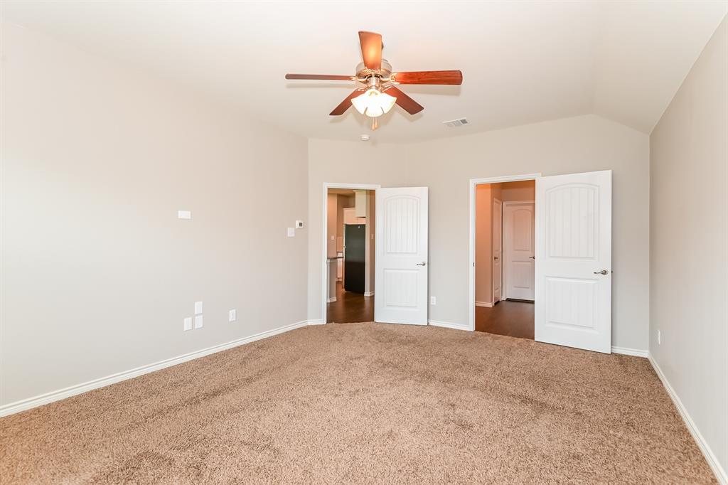 571 Kara Drive Fate, TX 75087 - Photo 9 of 16 a view of a big room with closet and ceiling fan