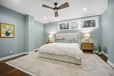 a spacious bathroom with a double vanity sink a large mirror and shower