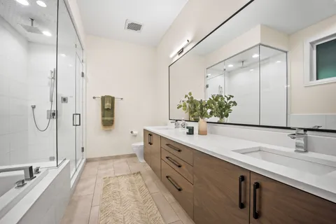 a bathroom with a bathtub and a shower