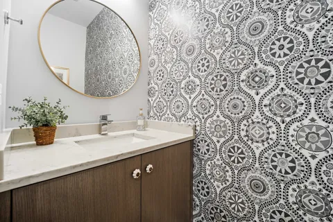 a kitchen with a table chairs stove and wooden floor