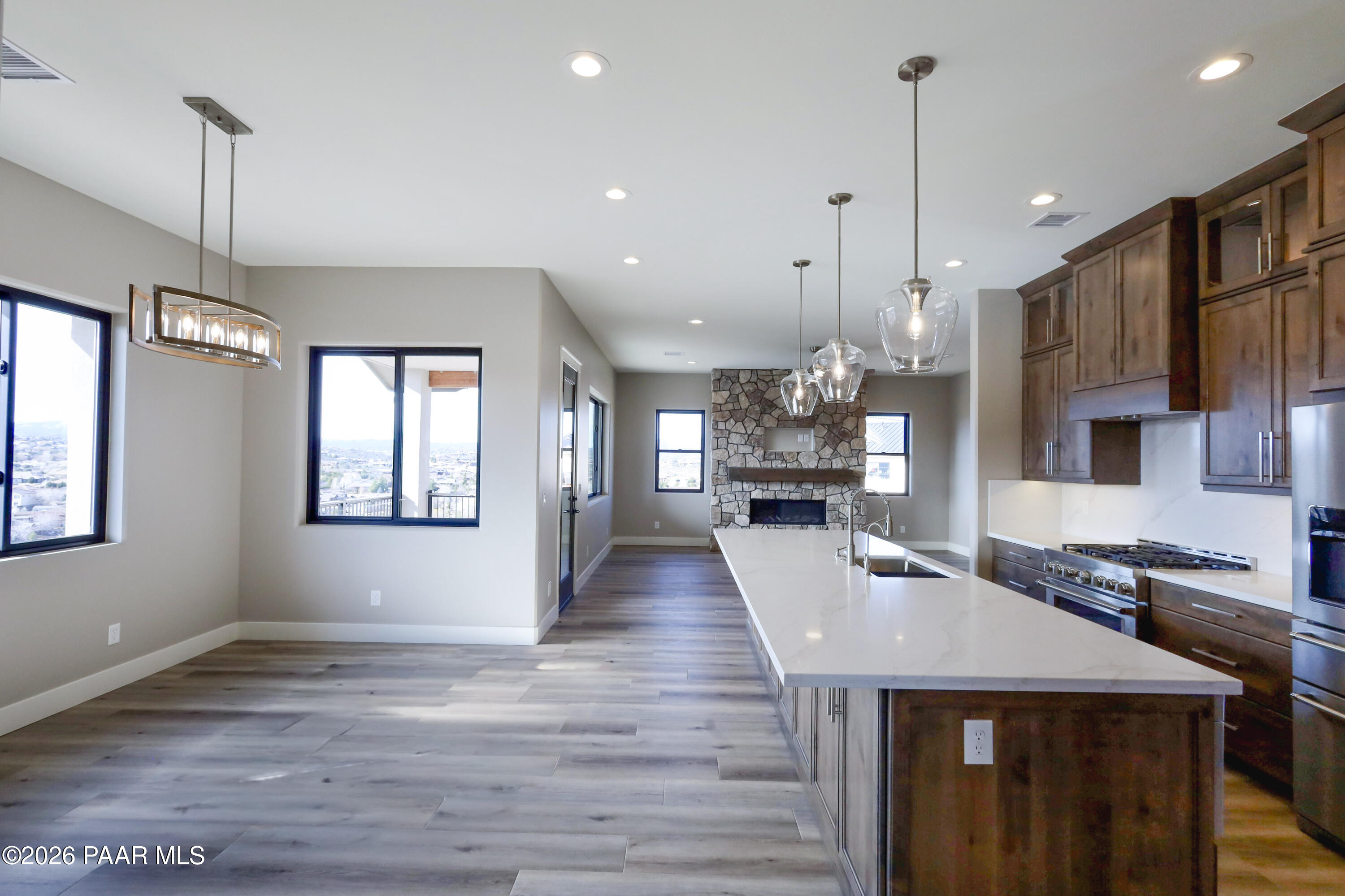 1941 Ventnor Circle Prescott, AZ 86301 - Photo 12 of 41 a view of a dining room and livingroom with furniture wooden floor a chandelier