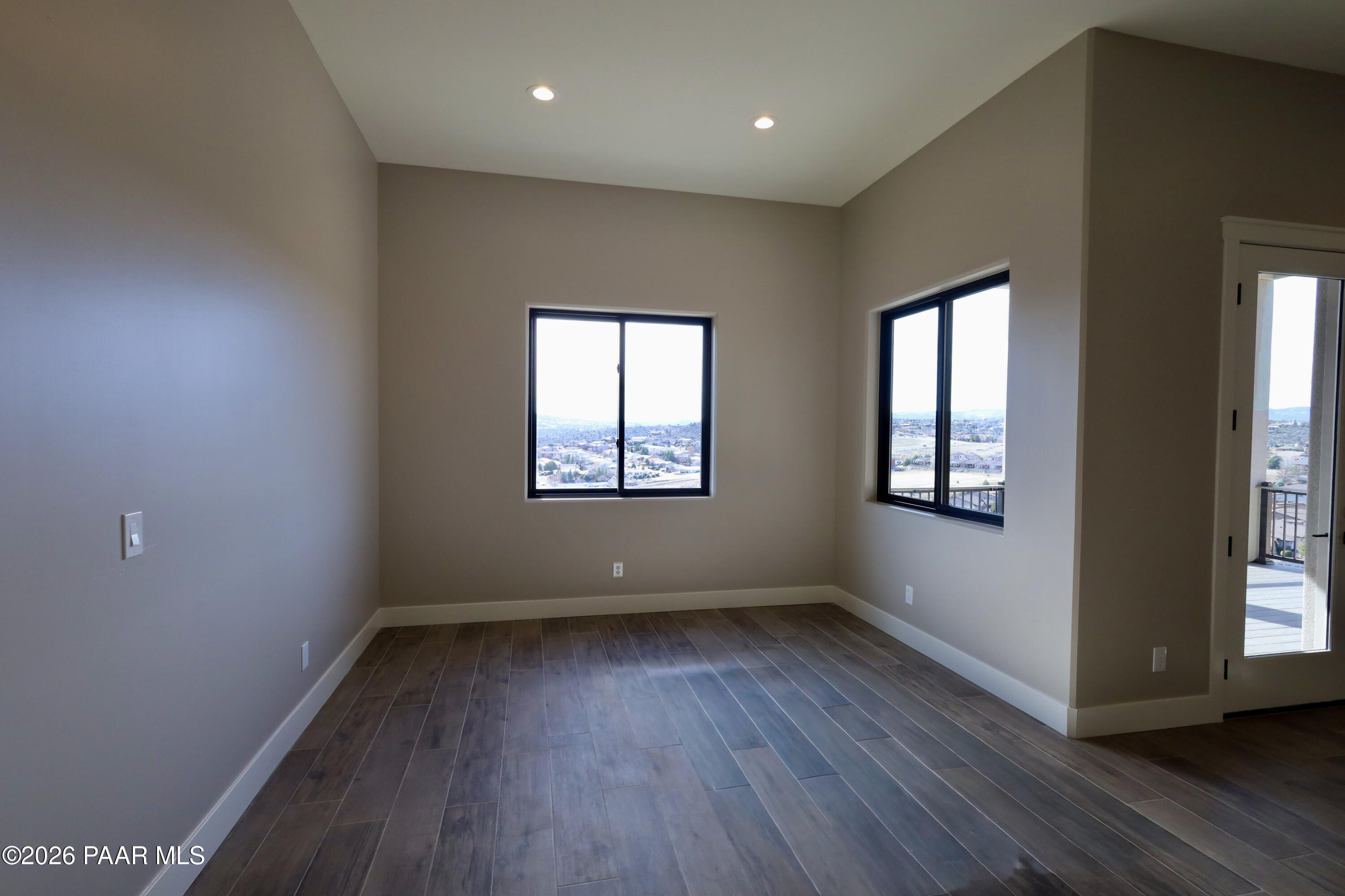 1941 Ventnor Circle Prescott, AZ 86301 - Photo 33 of 41 an empty room with wooden floor and windows
