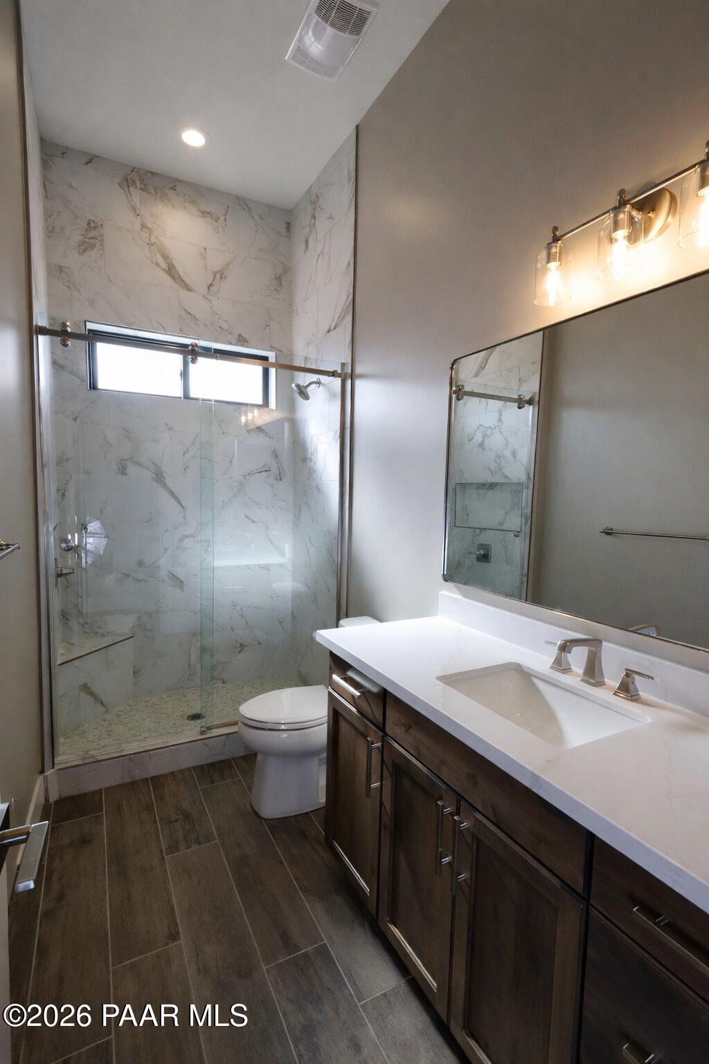 1941 Ventnor Circle Prescott, AZ 86301 - Photo 36 of 41 a bathroom with a sink a toilet a mirror and shower