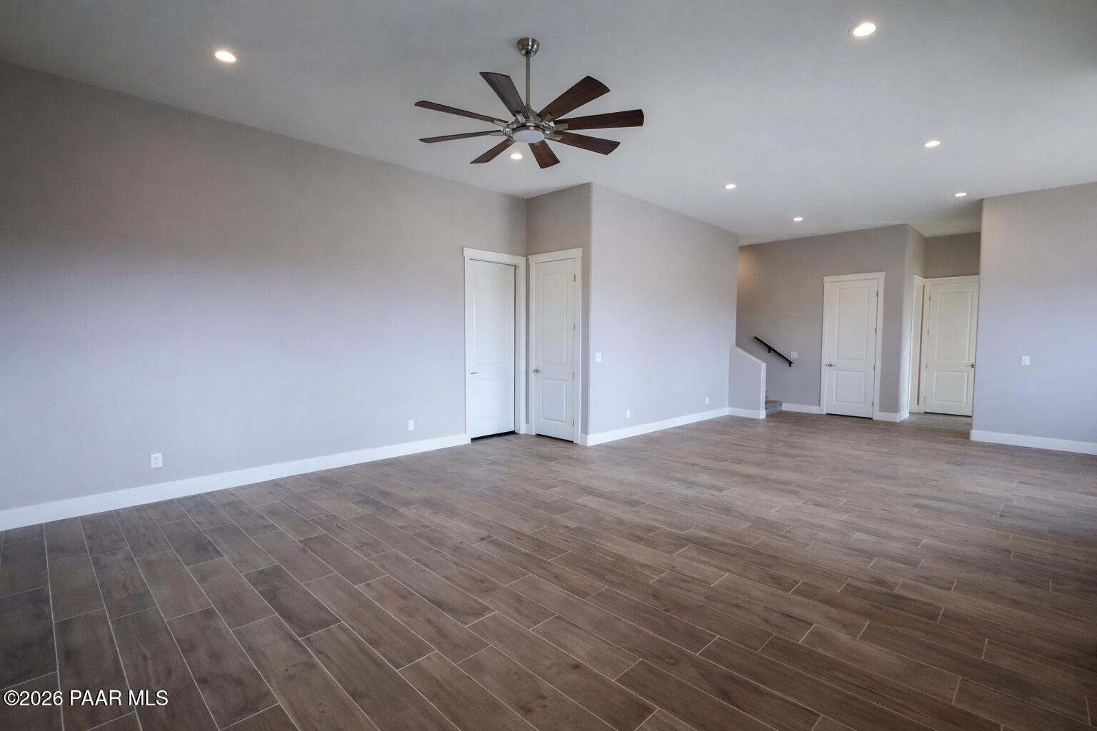1941 Ventnor Circle Prescott, AZ 86301 - Photo 39 of 41 an empty room with wooden floor and ceiling fan