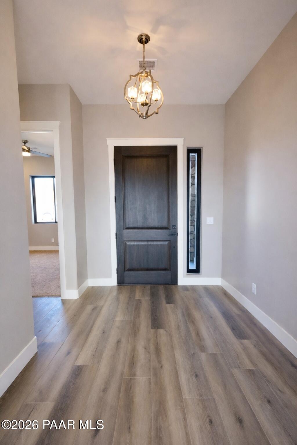 1941 Ventnor Circle Prescott, AZ 86301 - Photo 6 of 41 a view of an empty room with wooden floor and a window