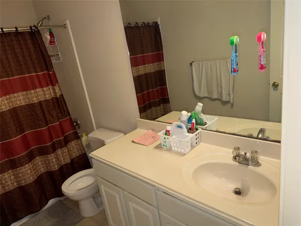 a view of a bedroom from a hallway