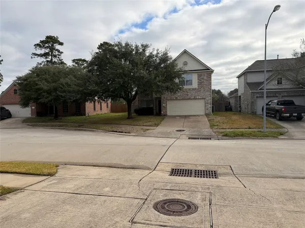 a view of a car park in front of house