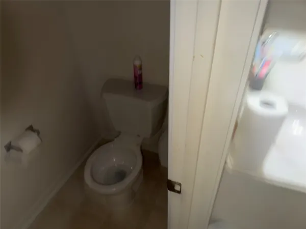 a bathroom with a toilet and a sink