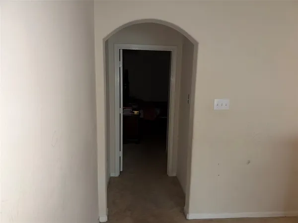 a living room with furniture rug and window