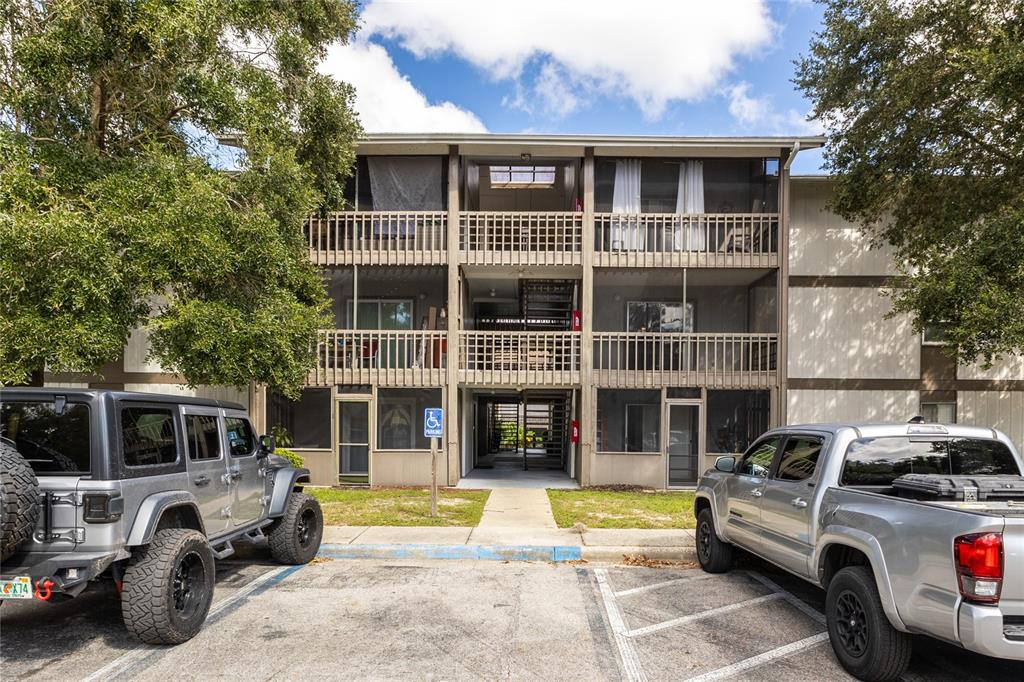 6519 West Newberry Road, Unit 805 Gainesville, FL 32605 - Photo 1 of 39 a view of a car parked in front of a building