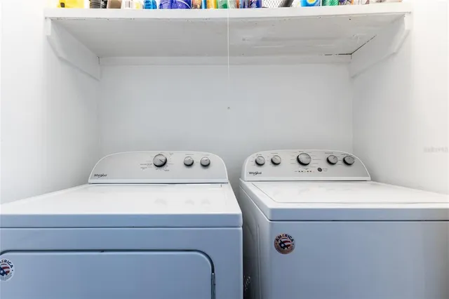 a utility room with dryer and washer