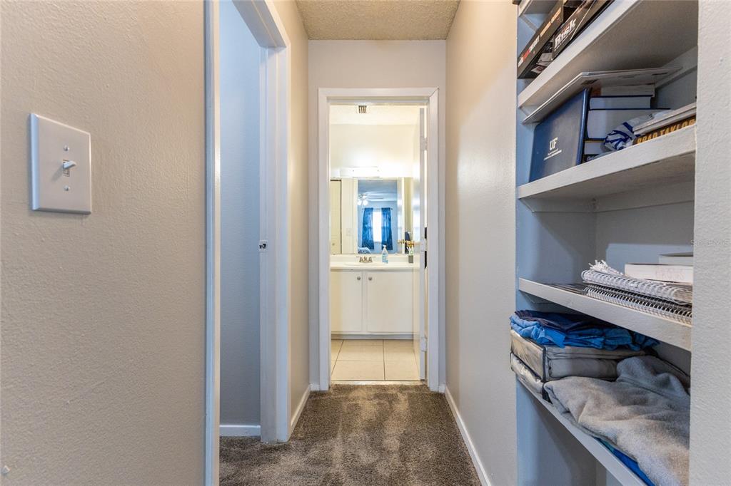 6519 West Newberry Road, Unit 805 Gainesville, FL 32605 - Photo 32 of 39 a view of a hallway and wooden floor a living room