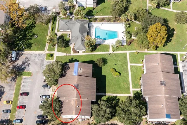 an aerial view of a house with a garden