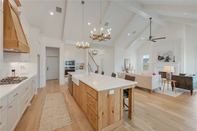 a spacious bathroom with a bathtub sink and mirror