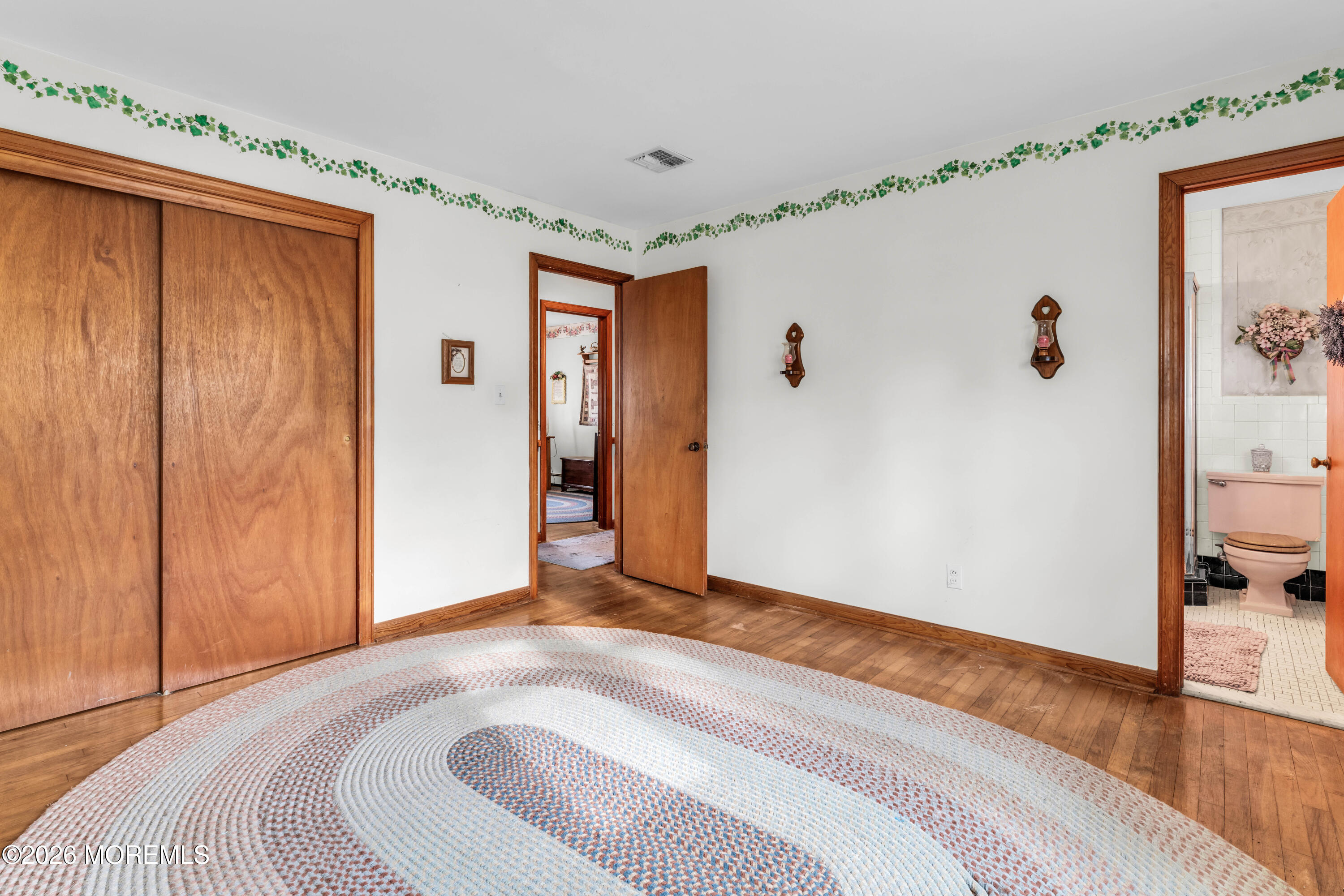 511 Robin Hood Road Brick, NJ 08724 - Photo 13 of 30 a bedroom with a bed and wooden floor