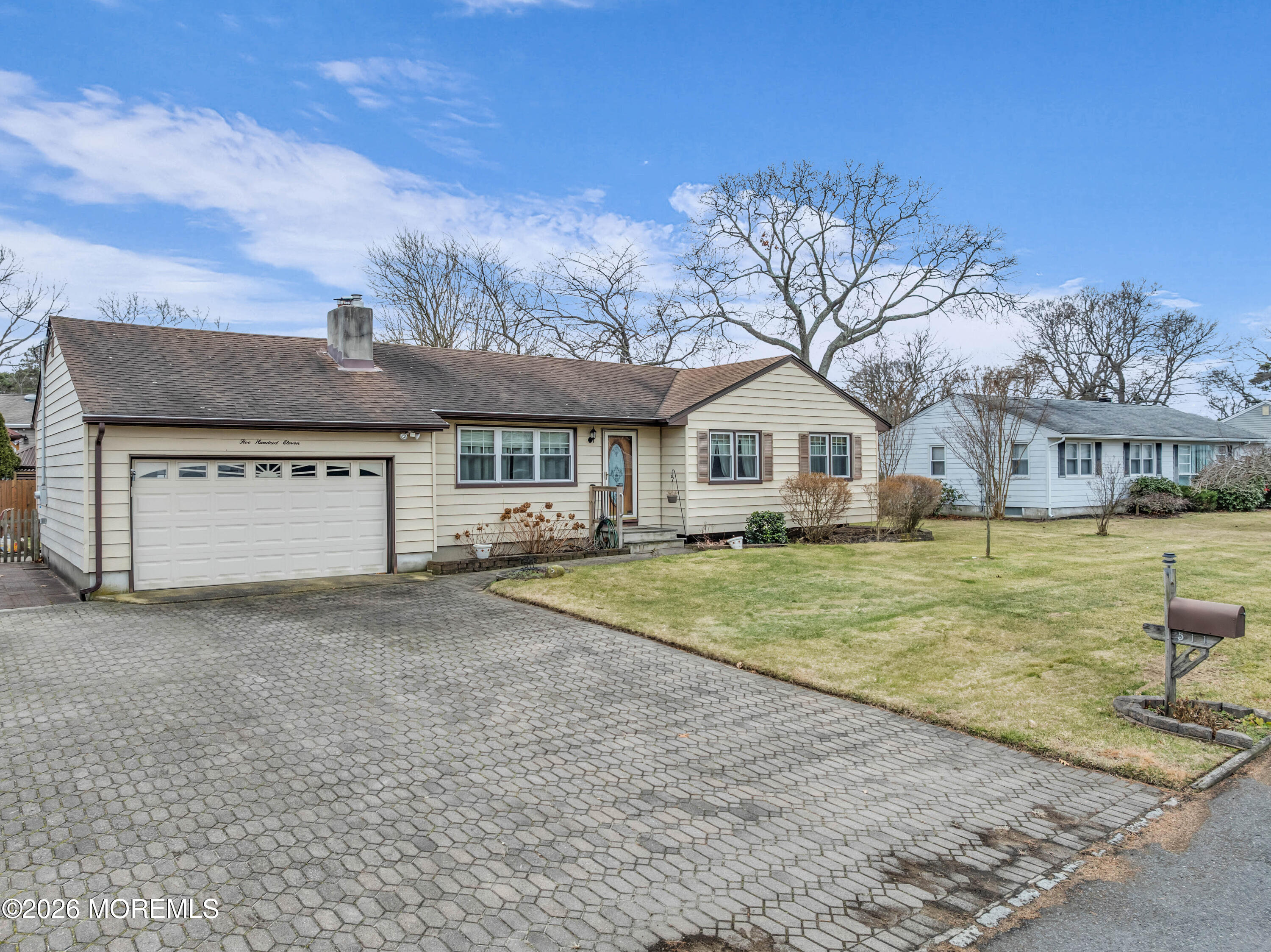 511 Robin Hood Road Brick, NJ 08724 - Photo 21 of 30 a front view of a house with garden