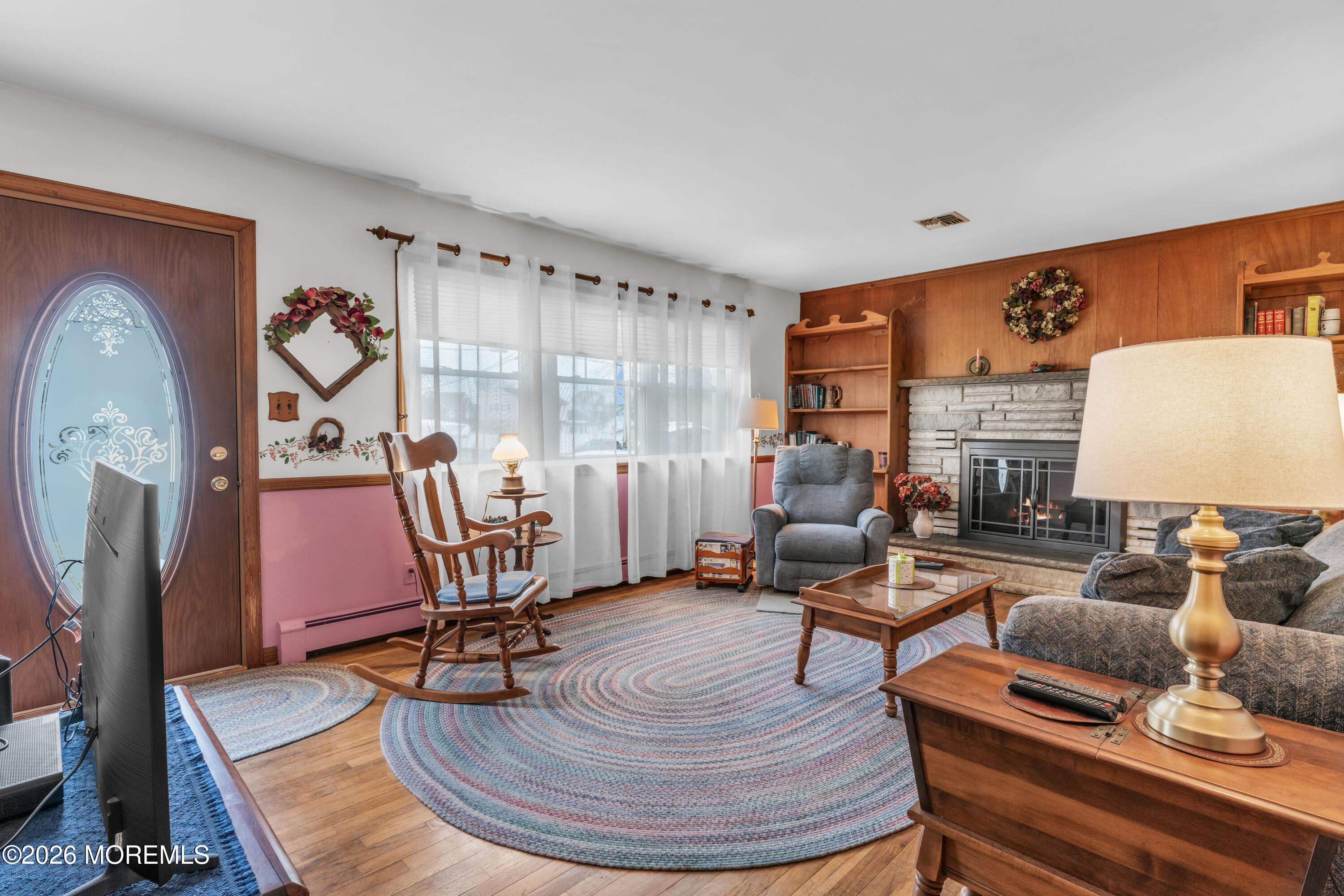 511 Robin Hood Road Brick, NJ 08724 - Photo 5 of 30 a living room with furniture gym equipment and a large window