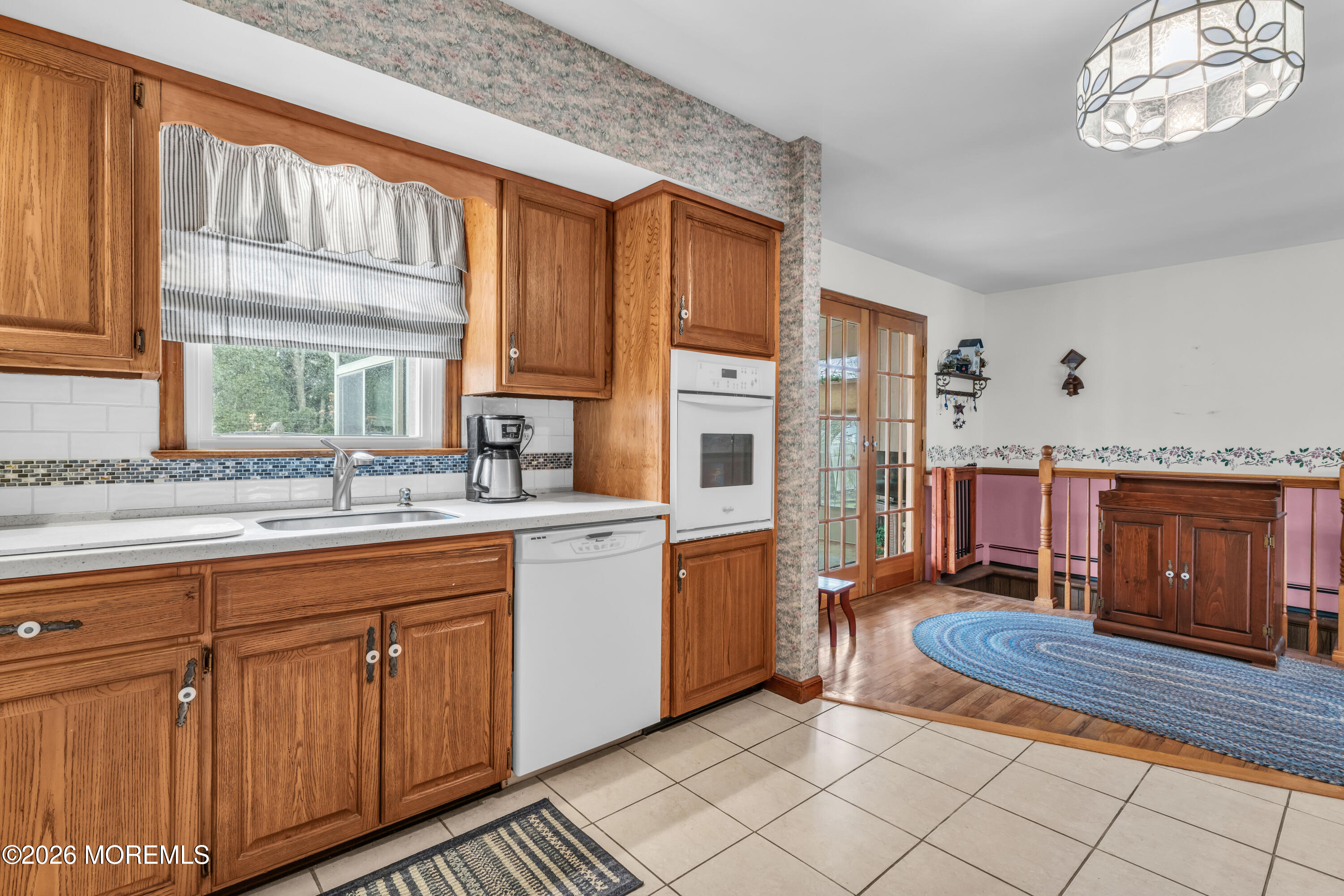 511 Robin Hood Road Brick, NJ 08724 - Photo 9 of 30 a kitchen with cabinets and outdoor view