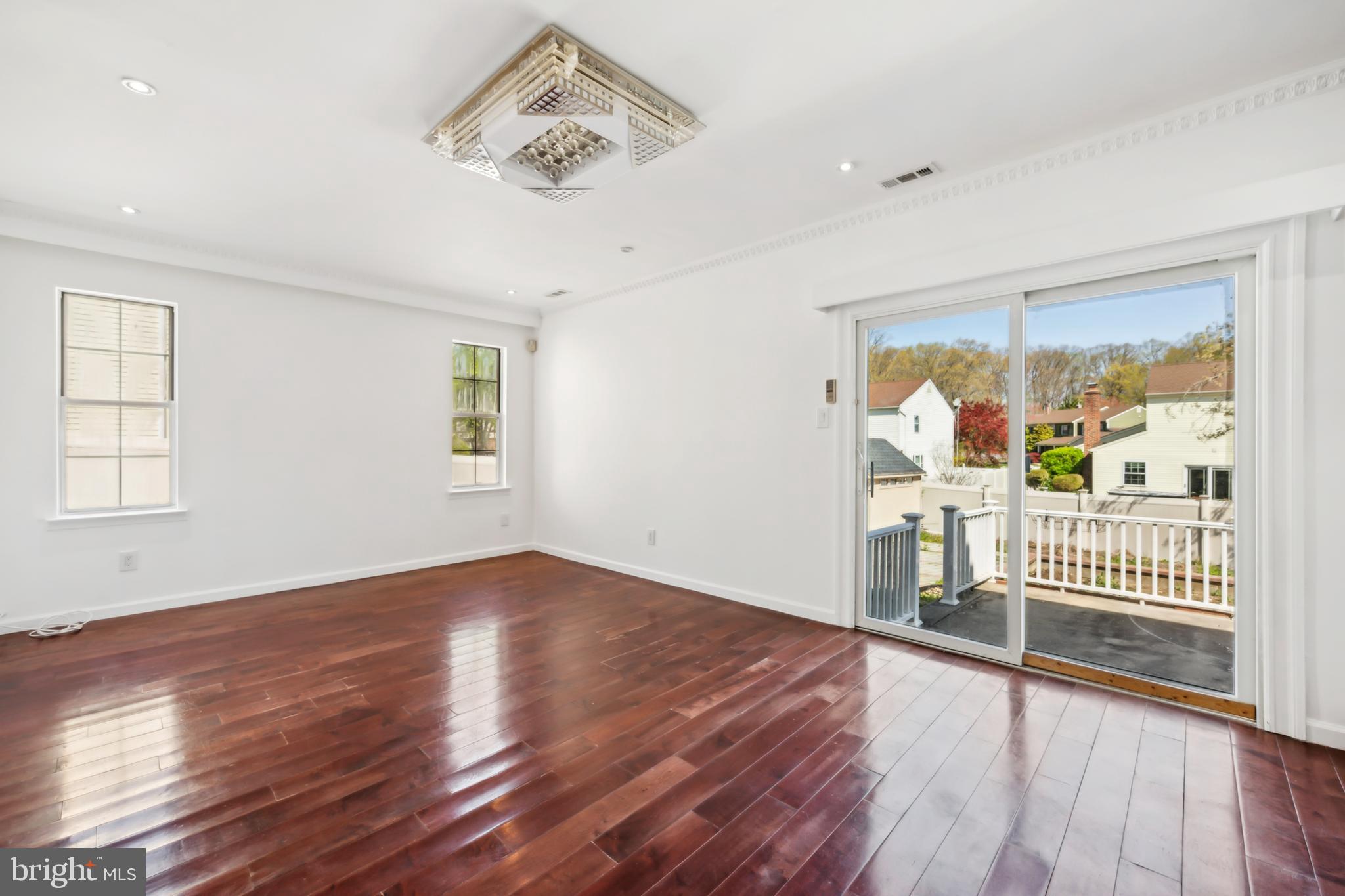 1986 Greentree Road Cherry Hill, NJ 08003 - Photo 12 of 25 an empty room with wooden floor and windows