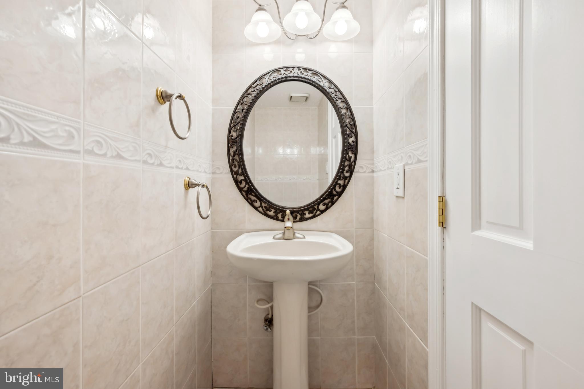 1986 Greentree Road Cherry Hill, NJ 08003 - Photo 15 of 25 a bathroom with a sink and a mirror