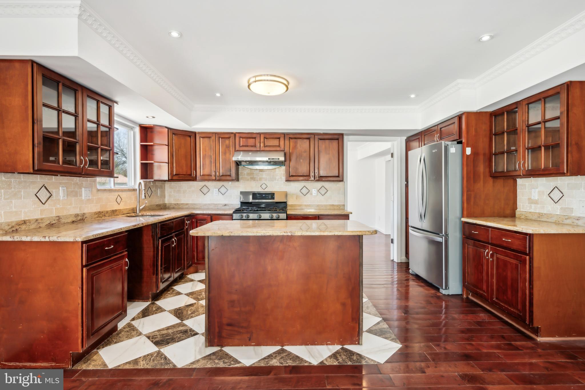 1986 Greentree Road Cherry Hill, NJ 08003 - Photo 9 of 25 a kitchen with stainless steel appliances granite countertop a refrigerator stove top oven and sink