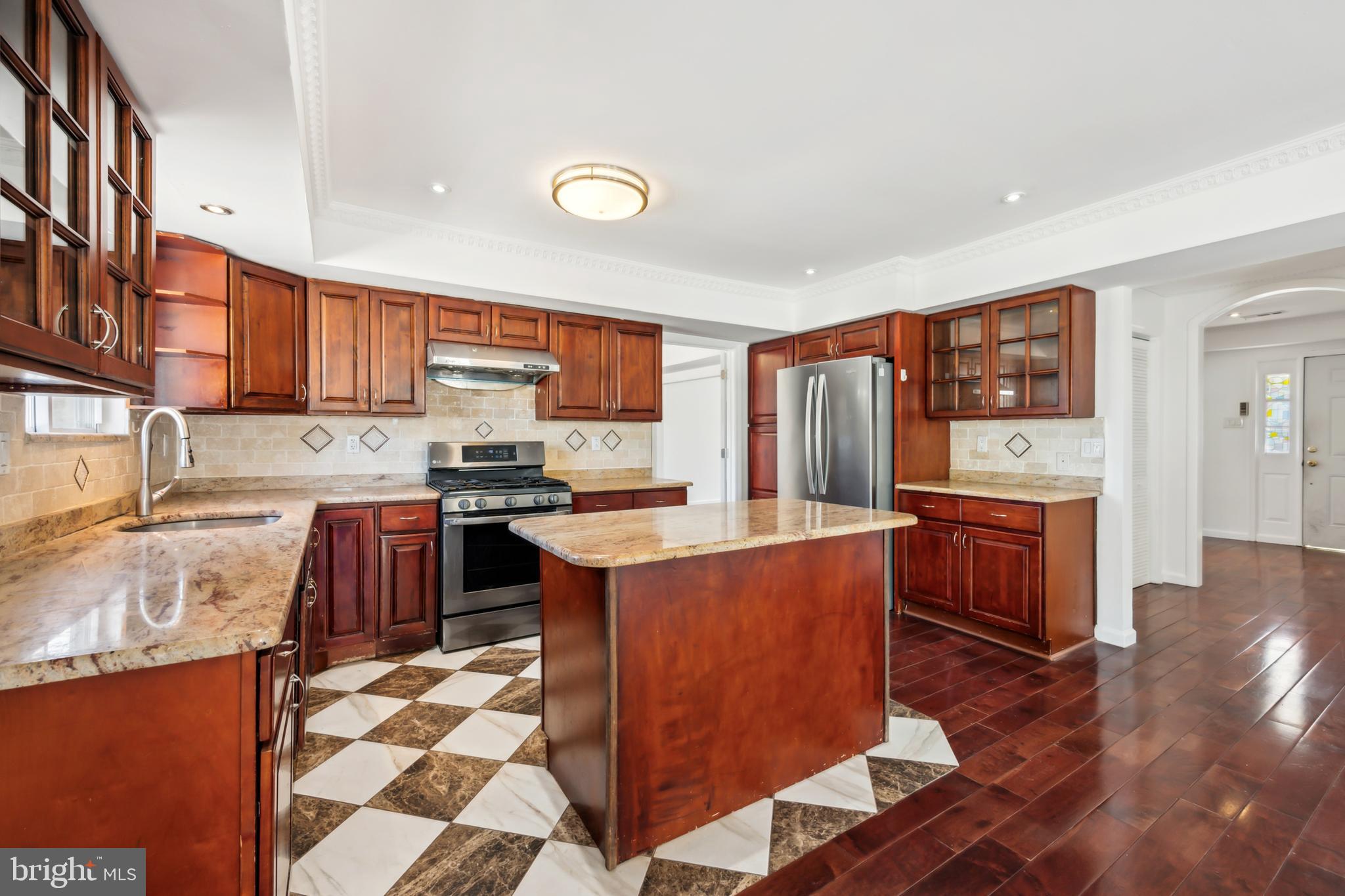 1986 Greentree Road Cherry Hill, NJ 08003 - Photo 10 of 25 a kitchen with stainless steel appliances granite countertop a refrigerator stove top oven and sink